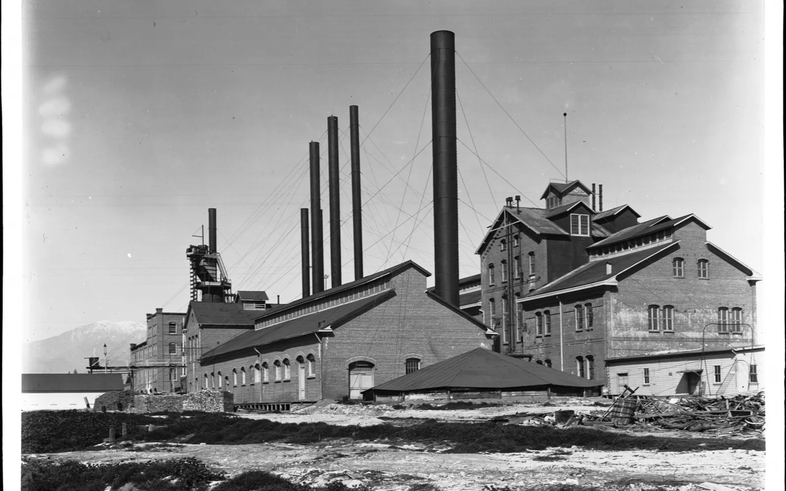 Aerial view of Chino sugar factory with industrial buildings, circa 1906